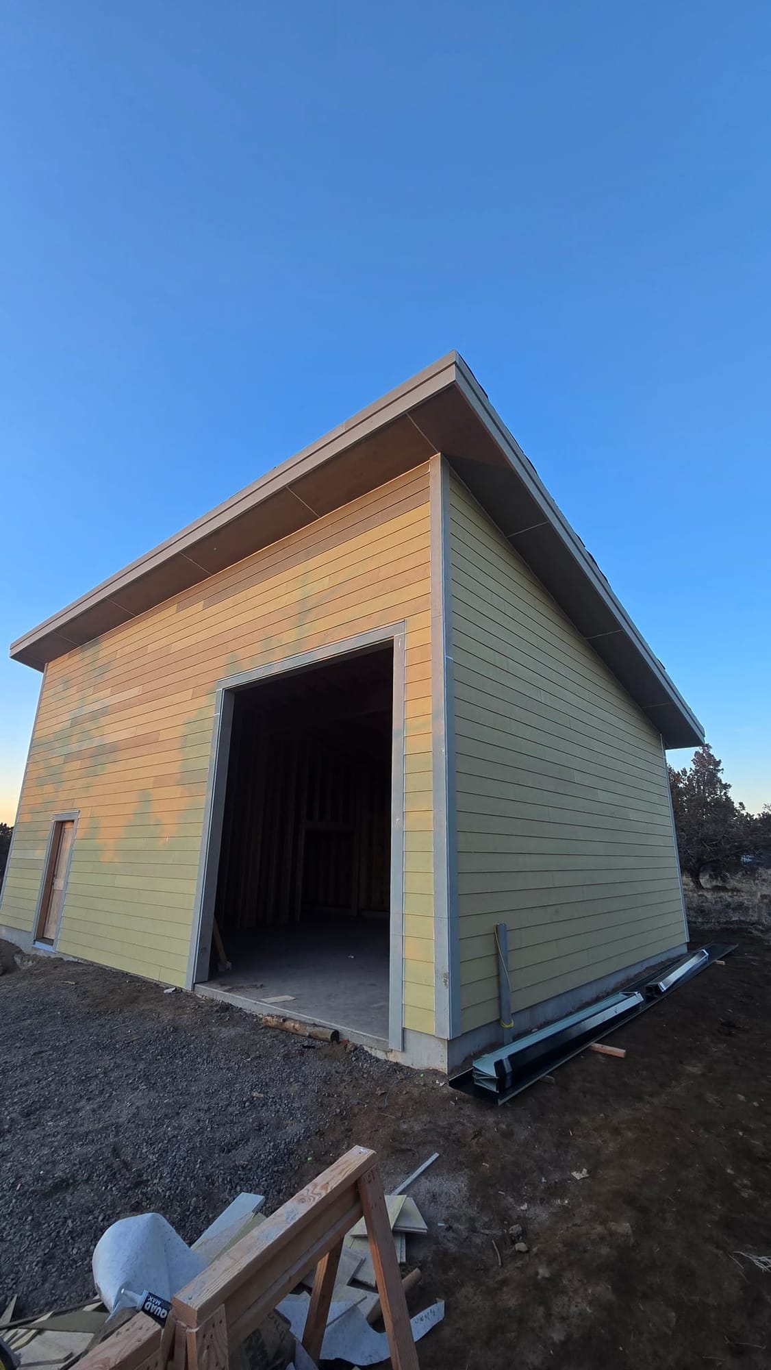 Detached modern wood shop with shed roof and lap siding in Tumalo, Oregon