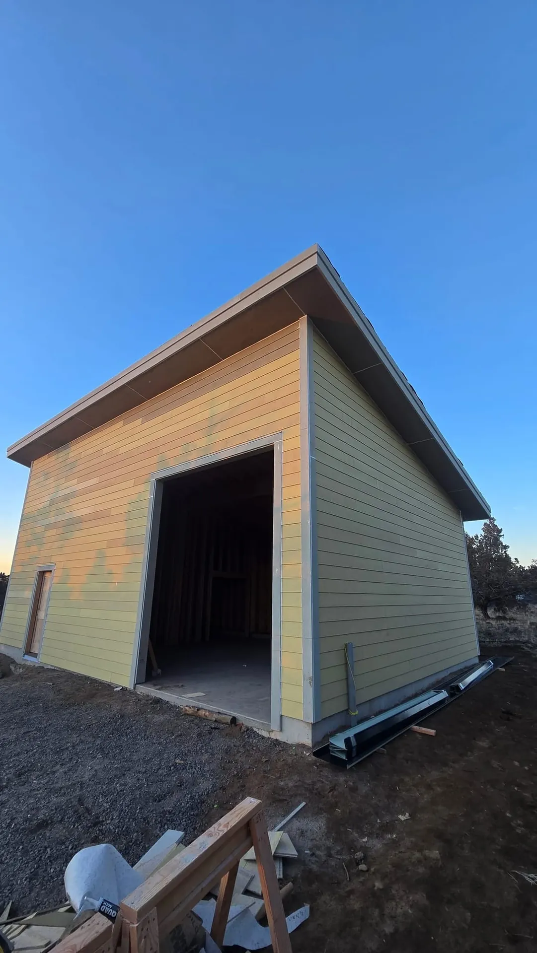 Detached modern wood shop with shed roof and lap siding in Tumalo, Oregon