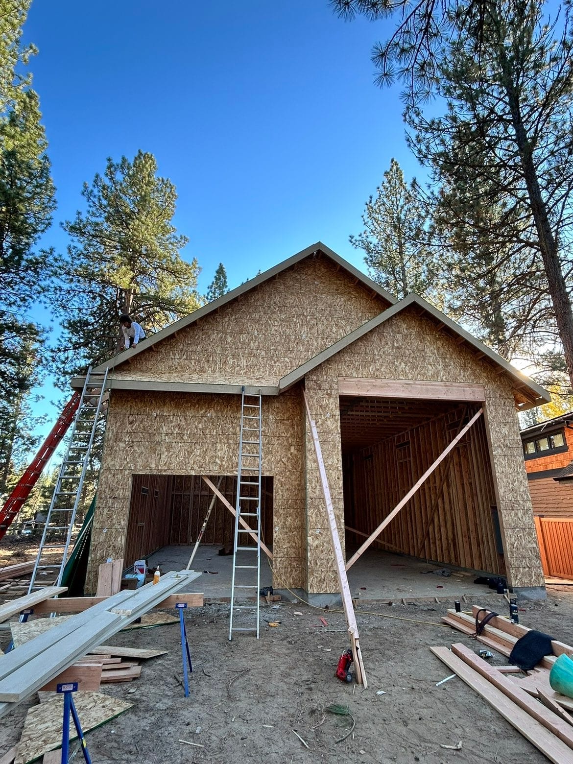 Detached craftsman gable garage and shop sheathed among the pines in Sunriver